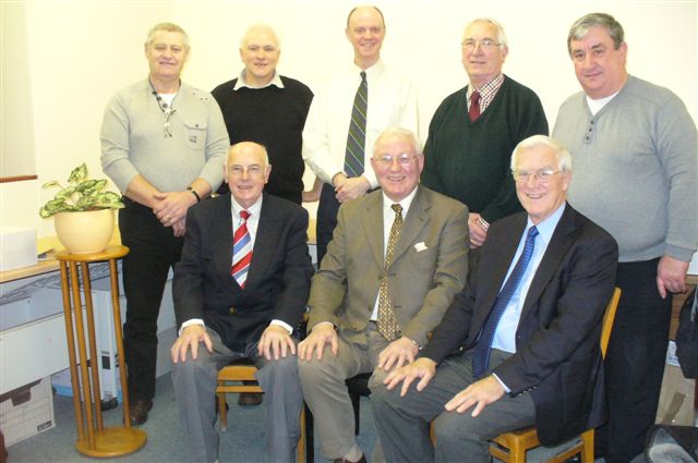 The photo shows the Trustees of the BPFMRT standing from left to right Ian Noble president SHU, DR Charles McSharry, Dr Ken Anderson,  Bill Frame, Andrew Garven secy. SNFC   sitting George pollock treasurer, Dr PP Lynch Chair,  Dr Gavin Boyd Medical Director.